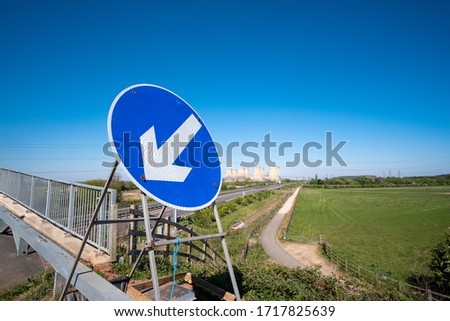 Large blue arrow road sign