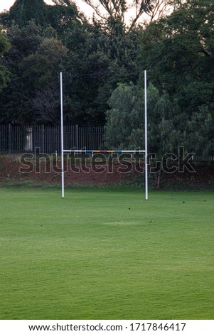 A rugby goal posts on a sports field