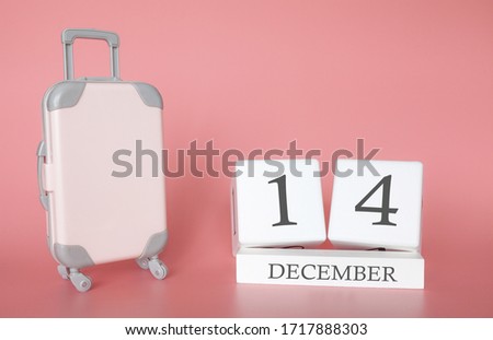 Calendar wooden cube. December 14, time for a winter holiday or travel, vacation calendar