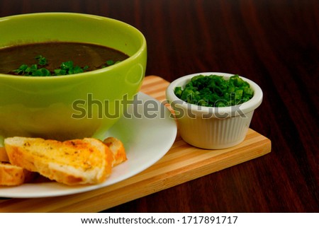Assortment with delicious grilled meats, on the plate and soups with meat vegetables, green at 45º angles