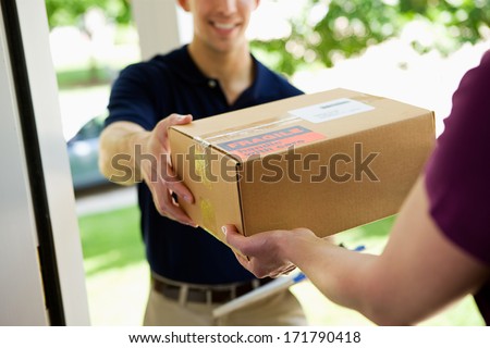 Delivery: Man Delivering Package To Homeowner Royalty-Free Stock Photo #171790418