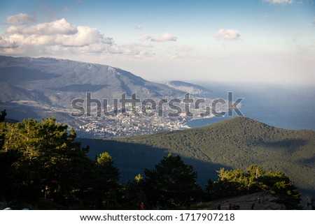 photo from the top of the mountain, view of the city, against the blue sky