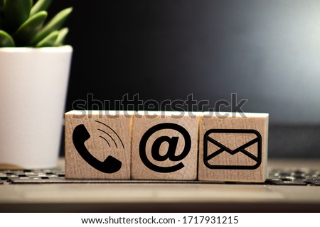 Website and Internet contact us page concept with black icons Royalty-Free Stock Photo #1717931215