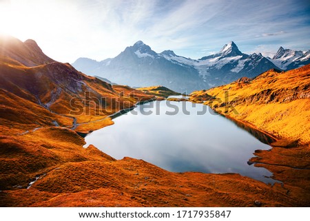 Great view of the Schreckhorn and Wetterhorn peaks. Location place Bachalpsee, Swiss alps, Switzerland, Grindelwald valley, Europe. Photo of popular tourist attraction. Discover the beauty of earth. 