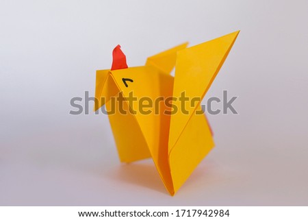 Hen origami isolated on white stock photo.