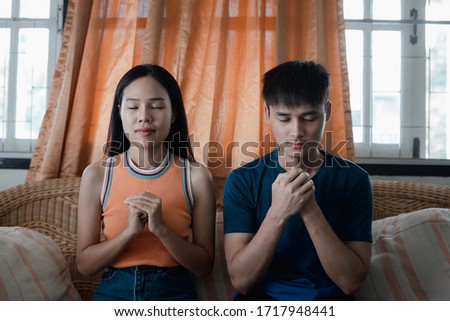 Couples while praying worship for christian religion in the room, Christian Religion concept.