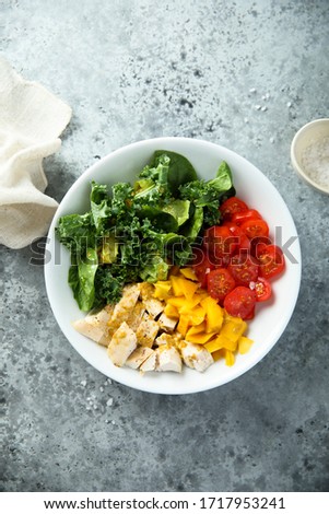 Healthy chicken bowl with kale