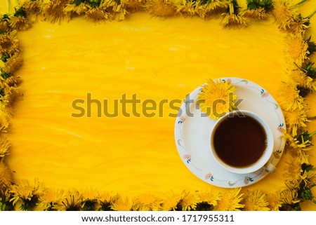 Arrangement of dandelions on yellow texture with empty space for text. Yellow summer flowers frame of flowers. Stay at home. Good morning