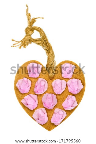 Handmade wooden heart decorated with paper roses on white background