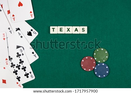 Texas poker concept with cards on the left and colored chips on the right with green background.