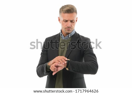 Punctuality is in the business world. Handsome man check watch. Businessman with wrist watch on hand. Mans watch. Portable timepiece. Fashion accessory. Formal style. Putting watch right.