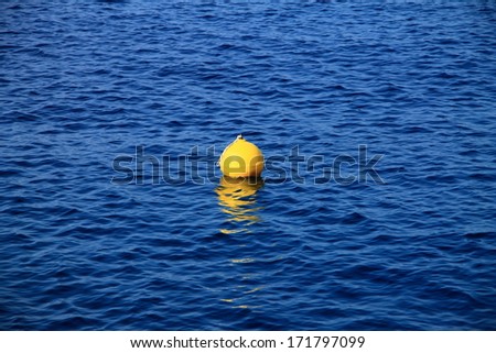 One yellow buoy at the Adriatic sea , Croatia