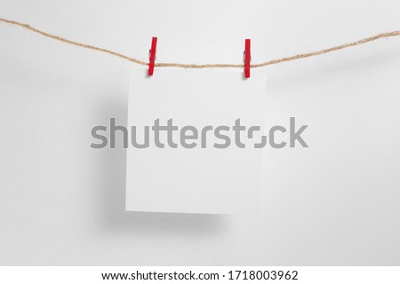 polaroid frame.Retro photo frames hanging on rope isolated on white background. real photo.