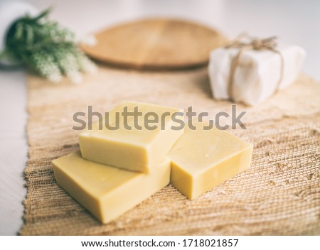 Handmade natural olive oil soap bars DIY homemade soap with lavender essentail oils - activity for what to do inside at home. Top view on decorative background. Royalty-Free Stock Photo #1718021857