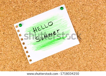 Pinned note on corkboard: "Hello Summer" written by hand on sheet of paper colored in green with crayon