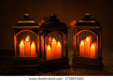 Picture of candles in pretty plastic boxes in a faint orange color to make scenes comfortable