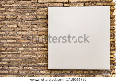 mock up blank white square canvas, small billboard for advertisement sales marketing strategy sign direction and information detail for adds, on brick wall in public area, for graphics logo and design