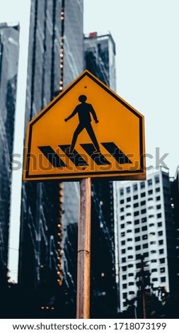 Street pole walking pedestrian sign