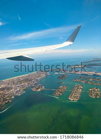 Aerial wing airplane. Views through the window of an airplane in Miami Beach.
