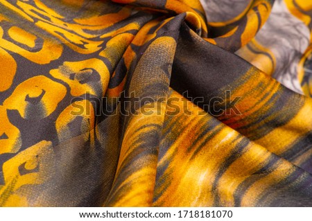 Texture, background, pattern, silk fabric, print on the theme of Africa, the skin of a wild beast