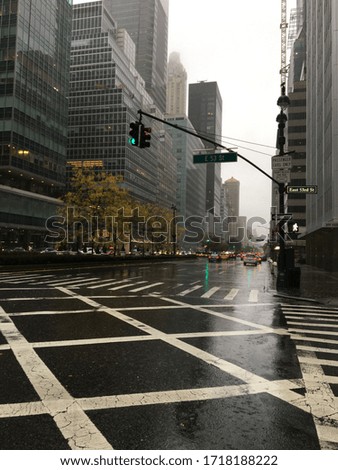 Picture of New York skyline in the clouds while nobody in the street due to heavy rains￼