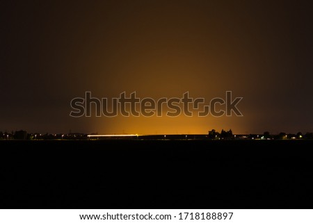 Night time image of light pollution by illuminated greenhouses in the western part of The Netherlands