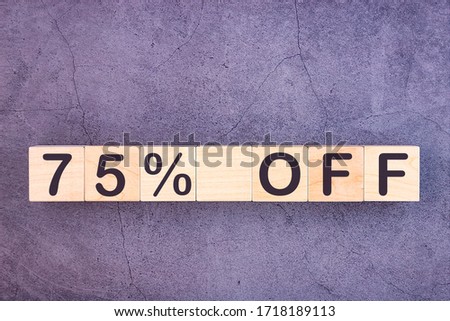 75 percent off text made with wood building blocks.
