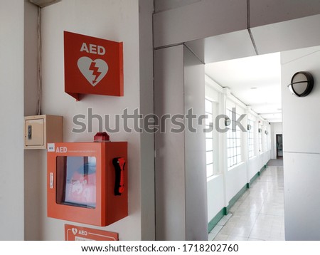 AED box or Automated External Defibrillator medical first aid device on white wall and background - It is portable electronic device that automatically diagnoses the life-threatening cardiac arrest

