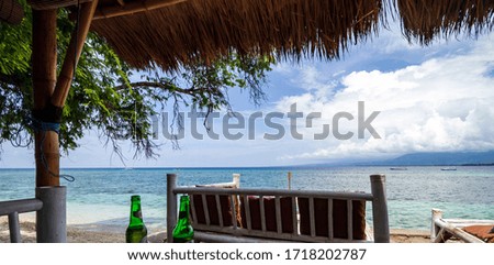 Tropical island beach bench and sea view