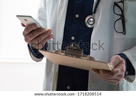 doctor using mobile phone close up view