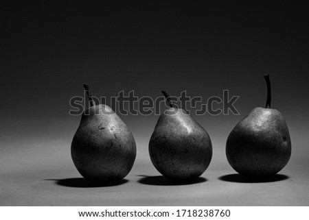 three pears photographed in a photo studio