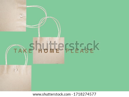 Paper bag for take home on pastel green background