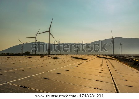 Aerial view of windmill and Solar panel, photovoltaic, alternative electricity source - concept of sustainable resources on a sunny day, Bac Phong, Thuan Bac, Ninh Thuan, Vietnam