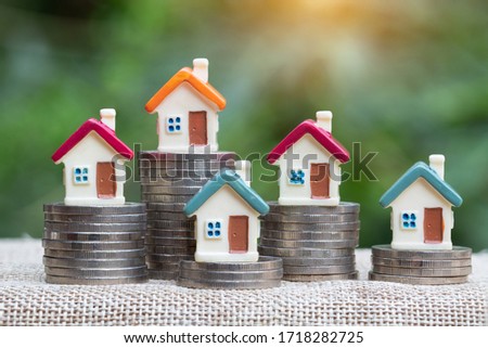coins money setting growth up increase to house model for concept investment mortgage finance and home loan business, business, innovation, growth and money Royalty-Free Stock Photo #1718282725