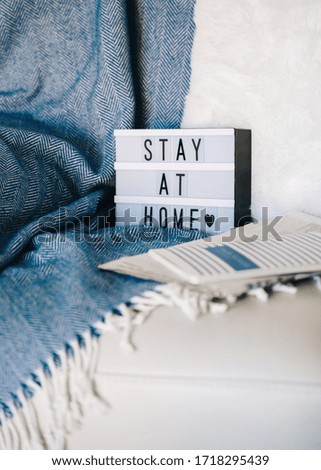 Stay at home Lightbox on sofa
