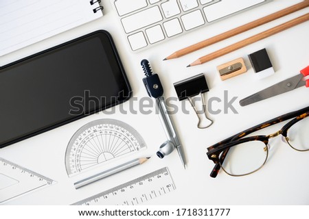 Top view table desk of office architect pencil, compasses tool, protractor grid background.