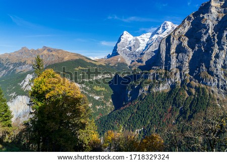 Alps mountains of Berner Oberland with Eiger, Monk and Jungfrau peaks, Switzerland Royalty-Free Stock Photo #1718329324