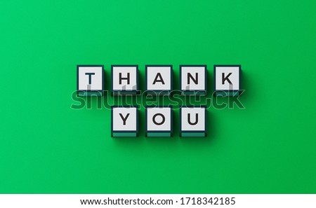 Top view of 3D rendering cubes with thank you words on green background – stock image