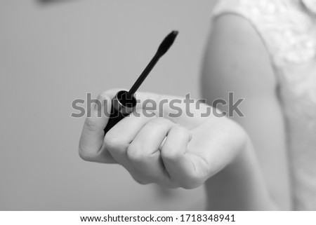 Makeup Brush in the Girl's Hand black and white photo