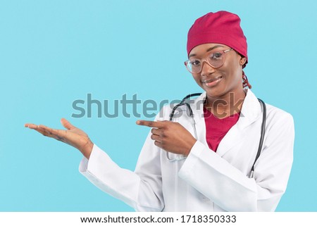 Female black doctor showing her right hand