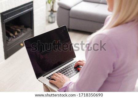 Woman with computer shopping online