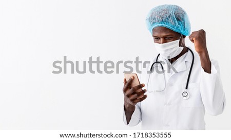 Success. Specialist black male doctor wearing medical cap and mask.