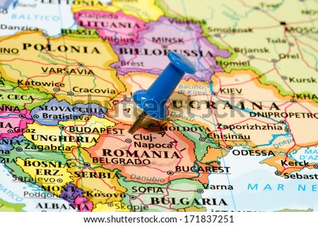 Map of Romania with a blue pushpin stuck Royalty-Free Stock Photo #171837251