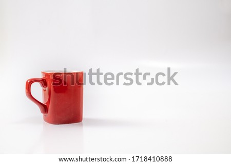 red breakfast cup on white background