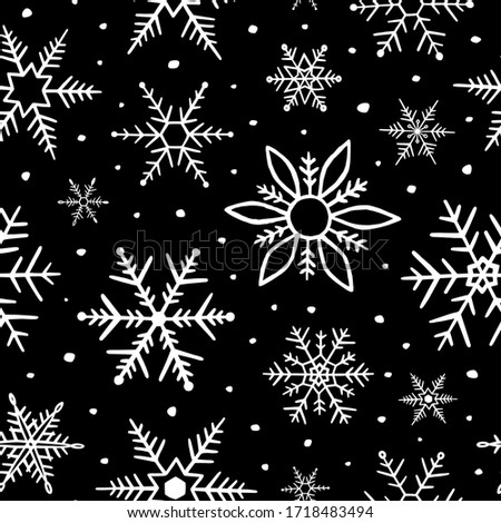 Snowflakes seamless pattern. Snowflake background. Winter design for prints. Handdrawn snow. Hand drawn falling snowflakes. Winter season. Black and white texture. Repeating snow flakes outlined
