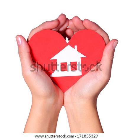 Paper House in Female Hands isolated on White Background. Concept Love and House