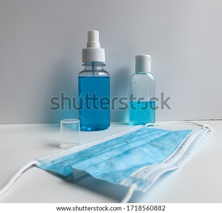 Concept of protection against viruses, bacteria and coronaviruses. Antiseptic hand gel, antiseptic spray and medical mask.
