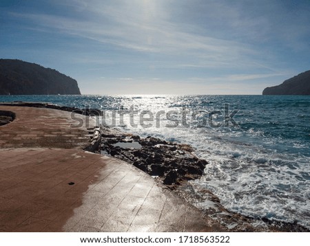 View of beautiful mole and beach in Camp de Mar, Majorca island, Spain