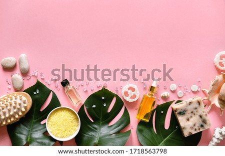 Spa cosmetics products, eco friendly bathroom accessories on pink background. Flat lay, top view