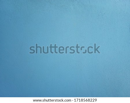 Smooth surface blue cement wall background in vintage style for graphic design or wallpaper